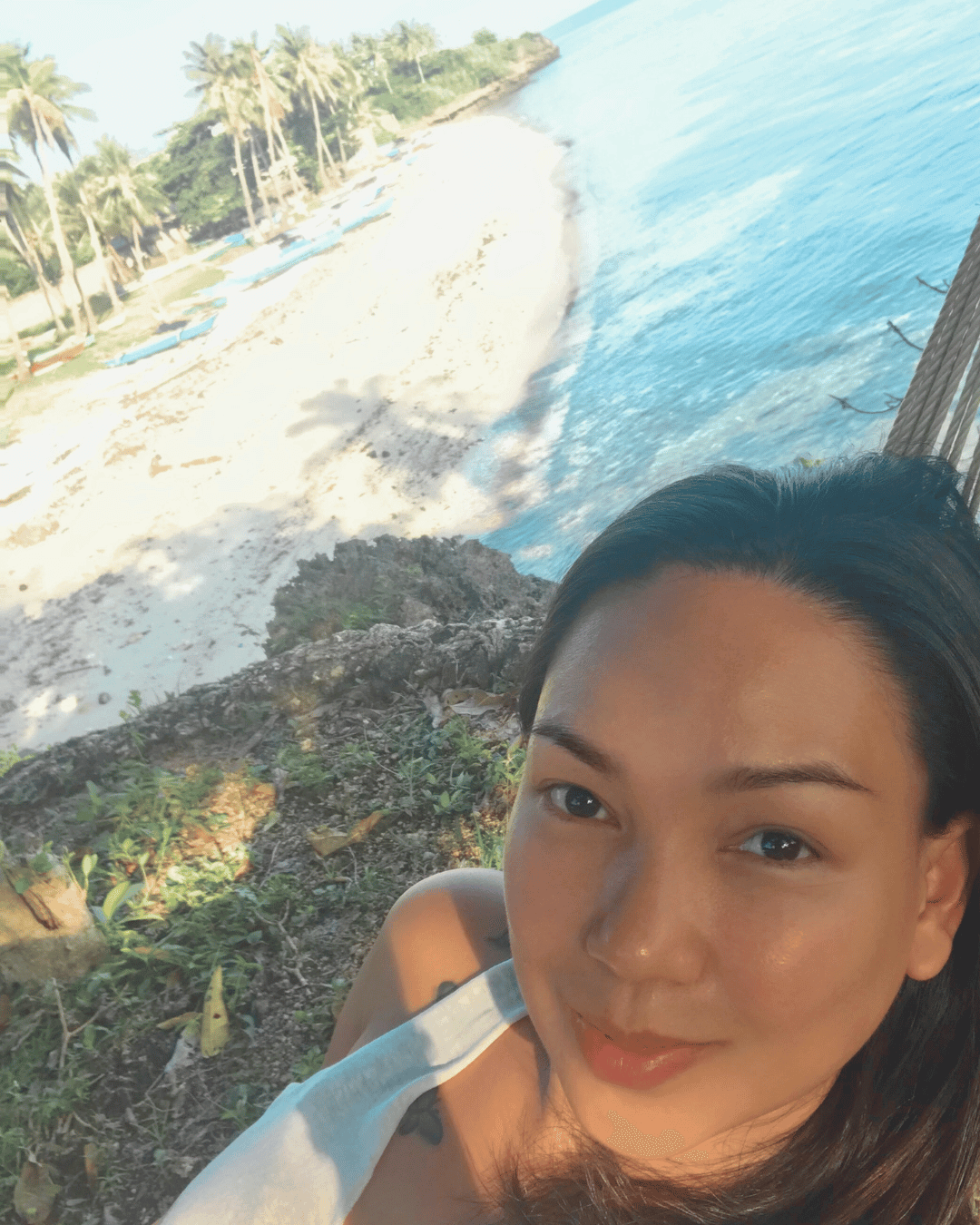 Islander Mom on a hammock by the beach