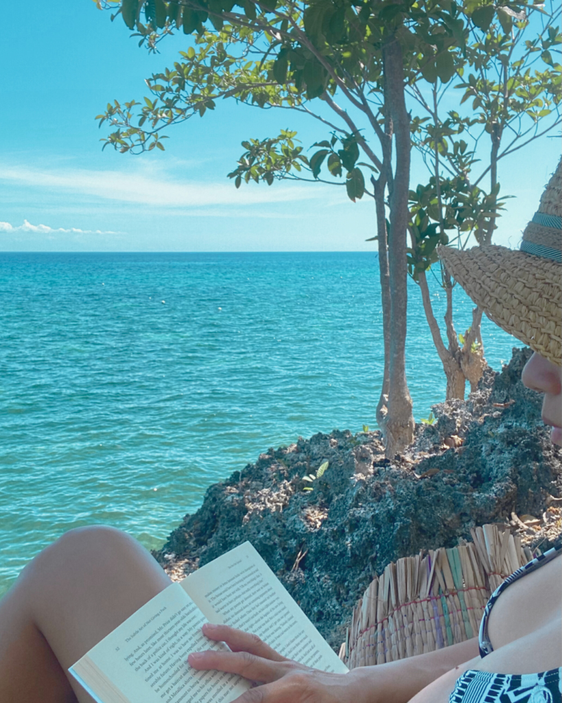 Mother Self-Care: Reading a book by the beach