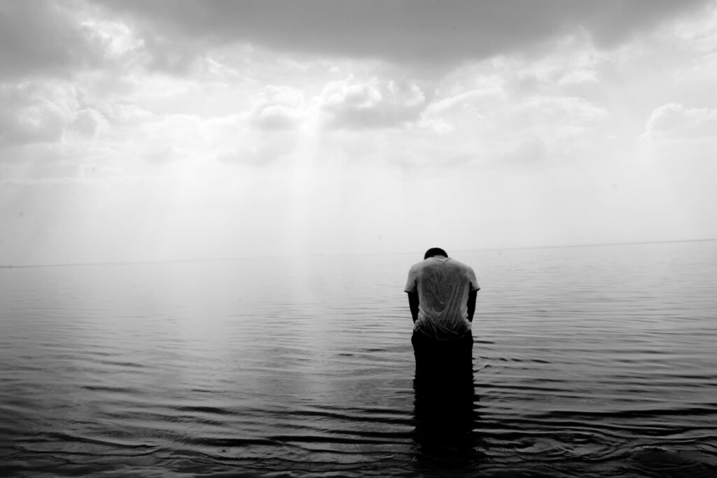 a person on the ocean, going through postpartum blues