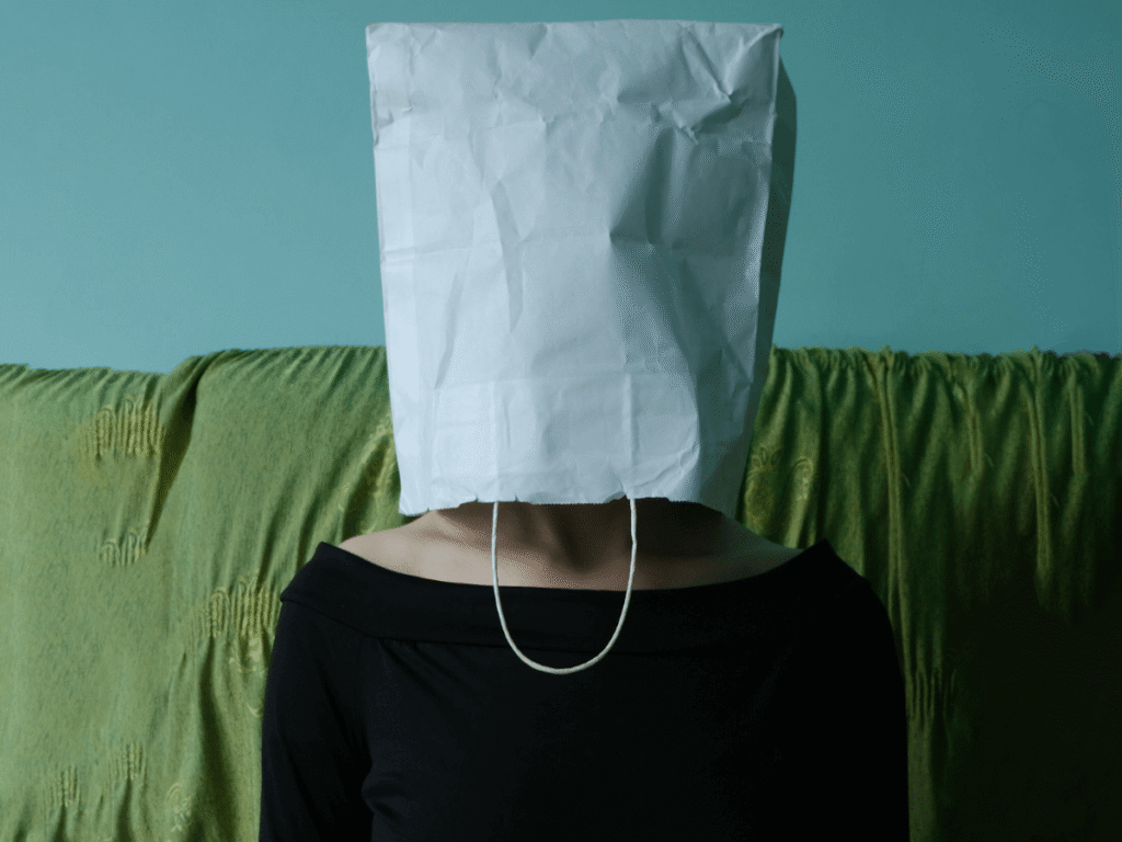 A woman with a paperbag on her head
