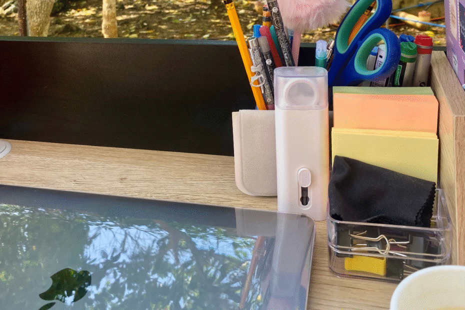Outdoor workspace with a laptop on a table by the ocean, symbolizing freedom and balance after giving up your career to be a stay-at-home mom.